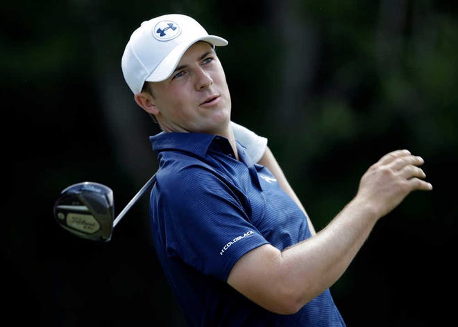 Jordan Spieth follows his shot from the seventh tee during the third round of The Players championship golf tournament at TPC Sawgrass, Saturday, May 10, 2014, in Ponte Vedra Beach, Fla. (AP Photo/Gerald Herbert)