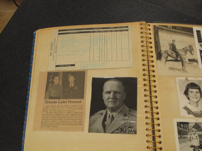 In this May 8, 2014 photo, a scrapbook kept by author Pat Conroy's father Donald is displayed at the University of South Carolina's library in Columbia, SC. Conroy is giving the university all of his papers including handwritten manuscripts, journals and even his divorce papers. (AP Photo/Jeffrey Collins)