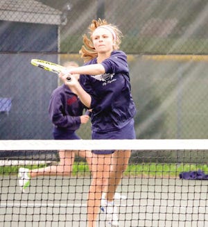 Ryan O'Leary phtoto Exeter High School senior Katie Wood makes a play at the net during Tuesday's Division I girls tennis match at Winnacunnet in Hampton. The Blue Hawks won 8-1.