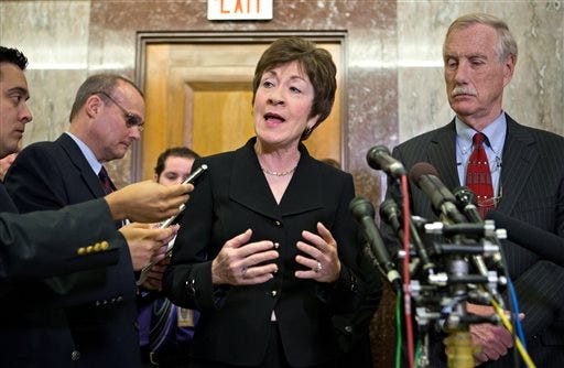 Following a meeting with Sen.-elect Angus King of Maine, right, Sen. Susan Collins, R-Maine, tells reporters that she wants answers from disgraced CIA Director David Petraeus, in this Tuesday, Nov. 13, 2012 file photo.