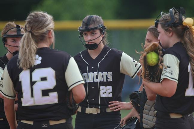 Cherryville pitcher Josie Allred takes advice from teammate Molly Morrow between batters Saturday night in a game against North Henderson. The Lady Ironmen went on to win, 6-0.