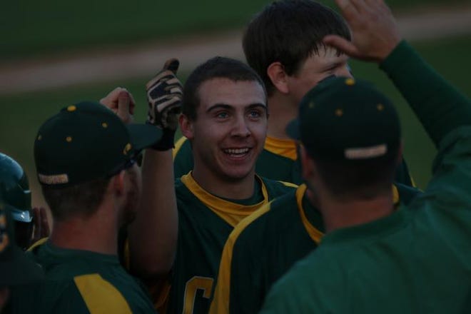 Crest's Colton Bowman celebrates with teammates after hitting home run in an 11-1 win against North Gaston.