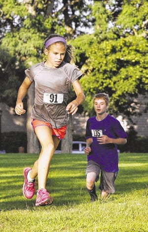 Meg Hughes, age 11, runs in last year's Marion Mile run.
