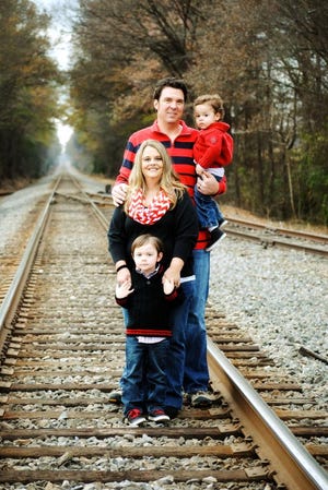 The Hughes family, from left, Gabriel, 4, Laura, David and Noah, 2.