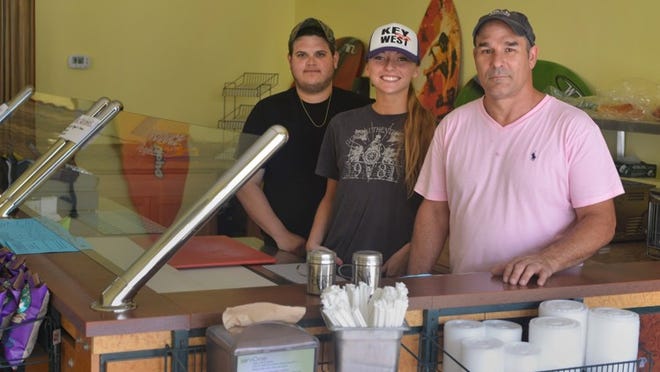 Ocean Sandwiches owner Michael Cohen, right, with employees Maximilian Willig and Sarah Menniti, welcomes customers to the new shop at 363 S. County Road.