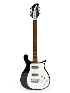 FILE - This undated file photo provided by Julien's Auctions shows the 1962 Rickenbacker 425 guitar that George Harrison played as The Beatles recorded "I Want to Hold Your Hand" at Abbey Road Studios. It sold for $657,000 at auction, Saturday, May 17, 2014 in New York. (AP Photo/Julien's Auctions, File)