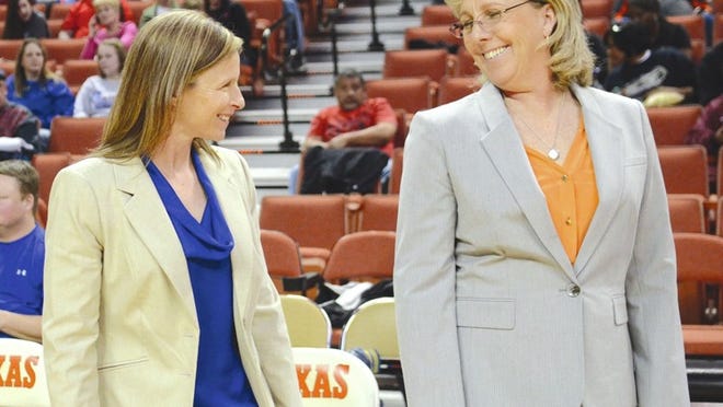 Pflugerville coach Nancy Walling and assistant coach April Hundl share a laugh during the Class 5A UIL State Tournament on Friday at the Frank Erwin Center in Austin.