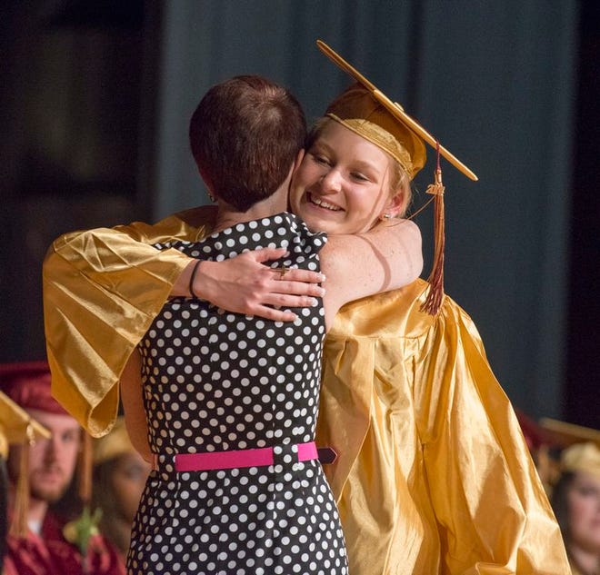 K.A. MacDonald photos/For The Patriot Ledger
Weymouth resident Sophia Spartos hugs Michele Prendergast, Weymouth Evening High School administrator, as she receives the Sharon Elizabeth Cleary Award at the evening school's graduation on Monday, May 19, 2014.