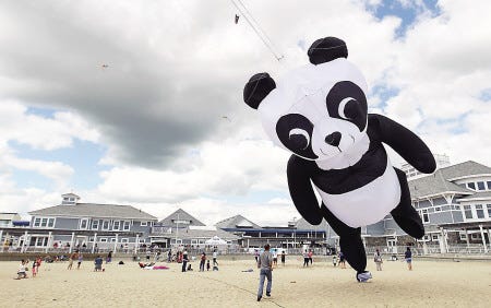 A giant panda kite is launched on the beach. The sky above Hampton Beach was filled with kites of all colors as a sign of hope and support during Exeter Hospital’s Kites Against Cancer event.