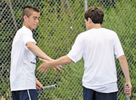 Exeter High School freshmen Tucker Guen (left) and Eric Schleicher react during their No. 3 doubles match on Thursday in Exeter. Guen and Schleicher rallied from a late deficit and the Exeter boys tennis team beat Winnacunnet 5-4.