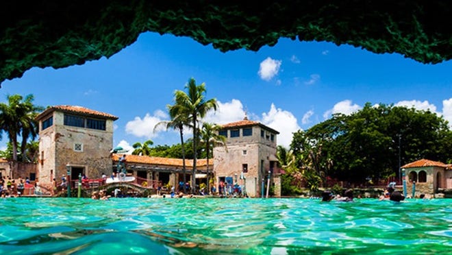 Carved out of a coral rock quarry, the Venetian Pool in Coral Gables has two waterfalls and a grotto.