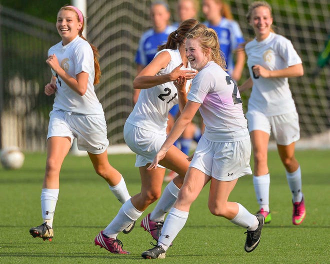 Topeka High's Brianna Ullom celebrates after adding another goal against Junction City Tuesday at Hummer Field in 6A regional play.