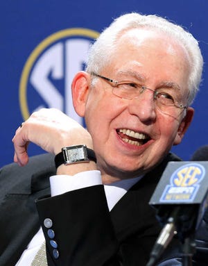 FILE - In this Dec. 6, 2013 file photo, Southeastern Conference Commissioner Mike Slive speaks during a press conference the day before the SEC Football Championship game at the Georgia Dome in Atlanta. Slive addresses an Associated Press Sports Editors meeting with athletes' unionization among the hot topics in college sports, Monday, April 21, 2014, in Birmingham, Ala. (AP Photo/Atlanta Journal-Constitution, Jason Getz, File) MARIETTA DAILY OUT; GWINNETT DAILY POST OUT; LOCAL TV OUT; WXIA-TV OUT; WGCL-TV OUT