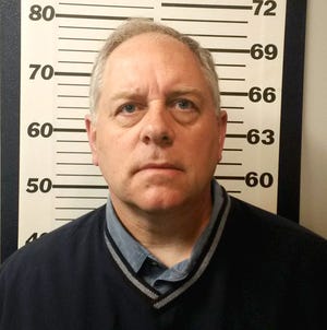 Longtime Berwick Academy chemistry treacher and coach Brian Sanborn has been fired by the school and was charged Tuesday with taking video up the skirt of a female student. Police say more charges are expected.