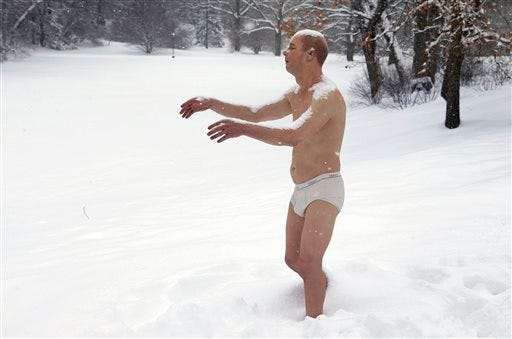 This Feb. 5, 2014 file photo shows a statue of a man sleepwalking in his underpants, called "Sleepwalker," which was part of an exhibit by sculptor Tony Matelli, surrounded by snow on the campus of Wellesley College, in Wellesley, Mass.