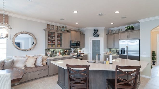 Each home in the luxurious, gated community of Vista Lago features beautiful wood kitchen cabinets, granite kitchen countertops, and stainless-steel kitchen appliances.