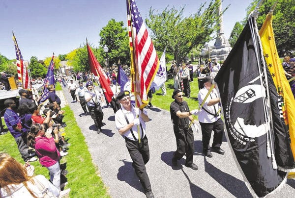 A contingent of Vietnam veterans passes the reviewing stand at Clasky-Common Park during the 2013 New Bedford Memorial Day Parade. Find details of this year’s observances on Page xx.