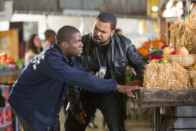 Kevin Hart, left, finds out that a ride along with his prospective brother-in-law Ice Cube on the "mean streets" of Atlanta is more than he bargained for in "Ride Along."