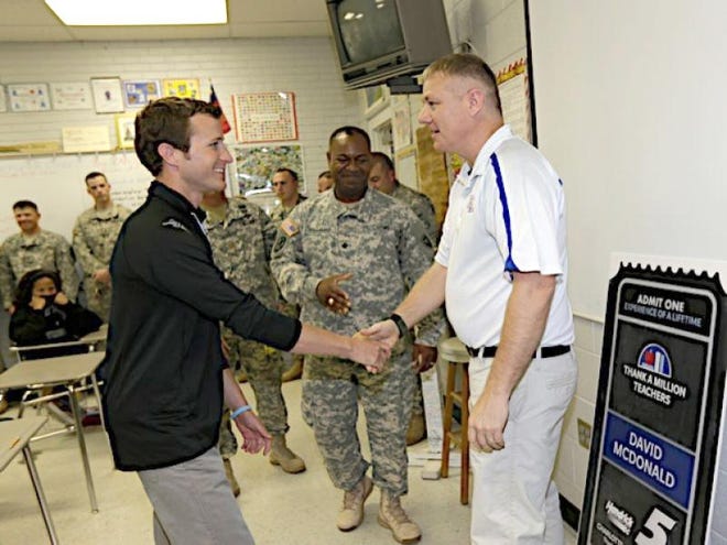 Kings Mountain Middle School teacher David McDonald was suprised Friday by his National Guard Troop and NASCAR driver Kasey Kahne as part of the "Thanks a Million Teachers" program.
