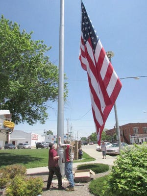 The 20- by 30-foot flag was hoisted Friday on the former Kewanee Boiler Co. pole in the 200 block of West Third Street in downtown Kewanee.