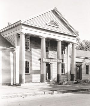 The "temple front" of the current Middleborough Police Station pictured in April 1934 has long been a local landmark of historic and architectural significance. Constructed about 1834-35, the structure originally housed the mercantile store of Peter H. Peirce, Middleborough's most prominent nineteenth century resident.