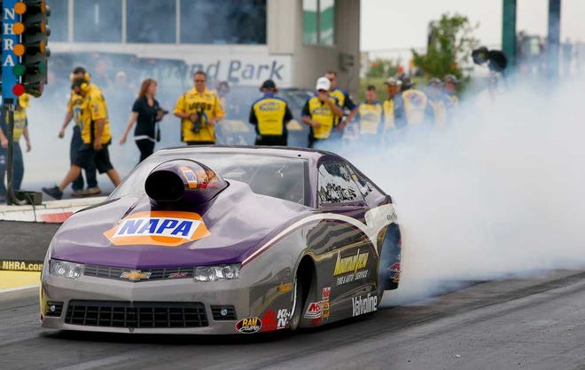 Vincent Nobile burns out prior to taking the number one qualifying spot in the Pro Stock division at the 2014 NHRA Kansas Nationals at Heartland Park. Nobile's first-round pass of 6.601 at 208.71mph stands as the first-day leader after Friday's scheduled second round of qualifications was canceled by rain.