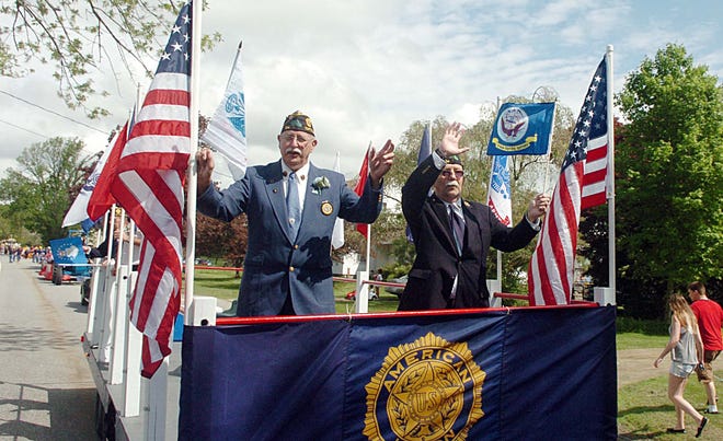 Veterans Lou Lurette, left, and Allen White, both of Norwich and American Legion Post 104 in Taftville, ride a float Saturday during the Lebanon Memorial Day Parade. See video and more photos at NorwichBulletin.com John Shishmanian/ NorwichBulletin.com