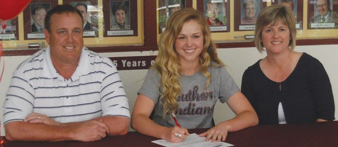 Recent East Peoria Community High School graduate Ally Watson, middle, signed May 8 with the University of Southern Indiana, where she will compete on the women's cross country and track and field teams for the Screaming Eagles. With Watson in the auditorium foyer were, from left: her father, Brice Watson, and mother, LuAnn Watson.