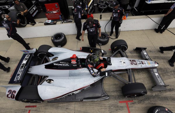 Kurt Busch climbs out of his car during practice for the Indianapolis 500 at the Indianapolis Motor Speedways.