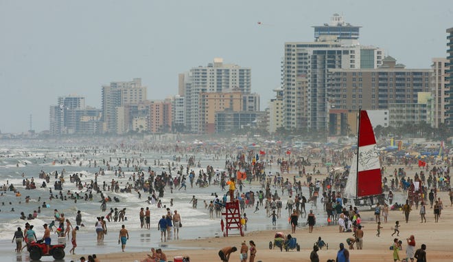 Memorial Day holiday crowds pack the beach in Daytona Beach on Monday.