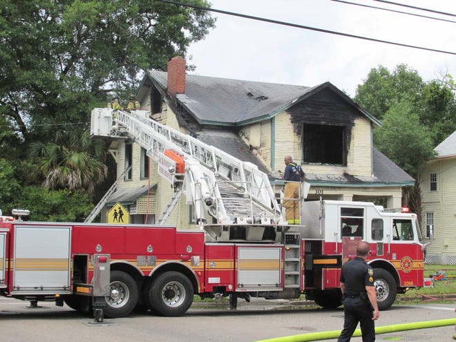 Rescue crews work to put out a fire in Jacksonville on Memorial Day afternoon.