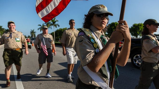 Josh Katz, 12, of Wellington, carries a flag for Boy Scouts of America Troop 160 at the Memorial Day parade and ceremony in Wellington.