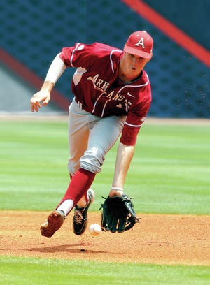 Arkansas' Brian Anderson (1) fields a ground ball against LSU during the first inning at the Southeastern Conference NCAA college baseball tournament on Saturday, May 24, 2014, in Hoover, Ala. (AP Photo/Butch Dill)