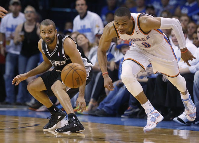 San Antonio Spurs guard Tony Parker, left, and Oklahoma City Thunder guard Russell Westbrook (0) chase a loose ball in the second quarter of Game 4 of the NBA Western Conference finals on Tuesday night in Oklahoma City.