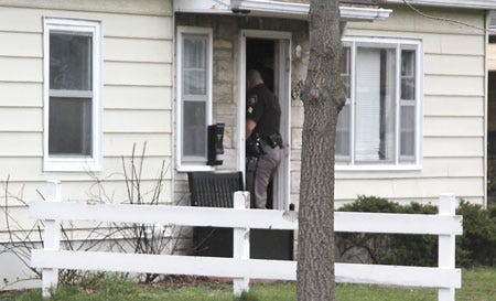 Police execute a search warrant in Sturgis recently during investigation into a series of break-ins.