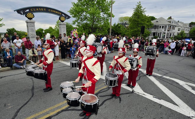 The New Bedford High School marching band pauses in front of the crowd at Clasky Common during Monday’s Memorial Day parade.