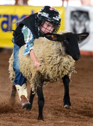 BRIAN D. SANDERFORD • TIMES RECORD
Alexander Heseman, 6, of Barling competes in a Mutton Bustin’ qualifying event prior to the Old Fort Days Rodeo at Kay Rodgers Park on Monday. Children can compete each night from 5 to 6:30 p.m. in Hugh Hardin Arena. The rodeo Grand Entry starts each night at 7 p.m. 
 BRIAN D. SANDERFORD • TIMES RECORD
Alexander Heseman, 6, of Barling competes in a Mutton Bustin’ qualifying event prior to the Old Fort Days Rodeo at Kay Rodgers Park on Monday. Children can compete each night from 5 to 6:30 p.m. in Hugh Hardin Arena. The rodeo Grand Entry starts each night at 7 p.m.