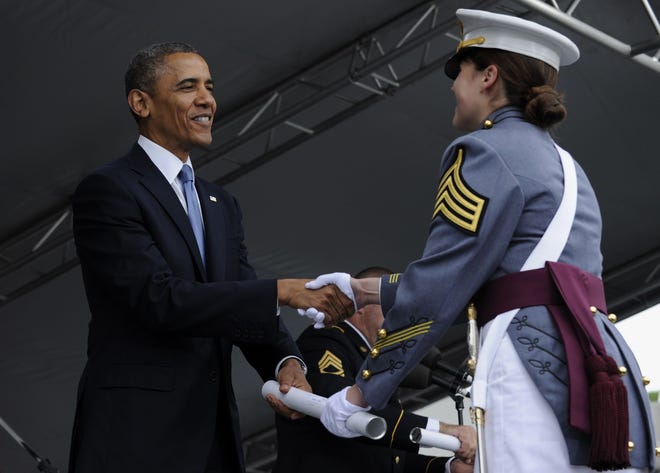 President Barack Obama hands out diploma to Calla Glavin, of Birmingham, Mich., during the commencement at the U.S. Military Academy at West Point’s Class of 2014, in West Point, N.Y., Wednesday, May 28, 2014.