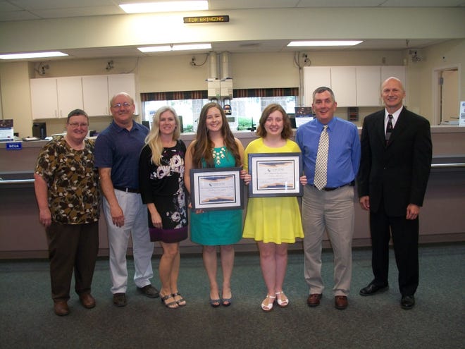 The recipients of the 2014 Georgia Heritage FCU college scholarships are South Effingham High School graduate Sydney Rushing and UGA student Brittany DeLettre. Shown are (L-R) GHFCU Board Chair Jan Griner; Daniel, Angela, and Brittany DeLettre; Sydney and William Rushing, and GHFCU President/CEO Dale Taratuta.