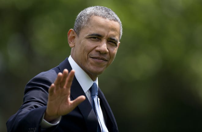 President Barack Obama waves as he walks from Marine One to the Oval Office of the White House, in Washington, Wednesday, May 28, 2014. In a new report, the Obama administration is making a concerted effort to cast its energy policy as an economic success.