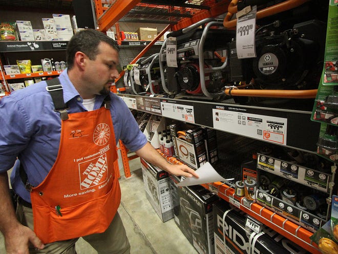 R.J. Murphy, assistant manager at The Home Depot in Daytona Beach, checks the supply of generators Thursday.