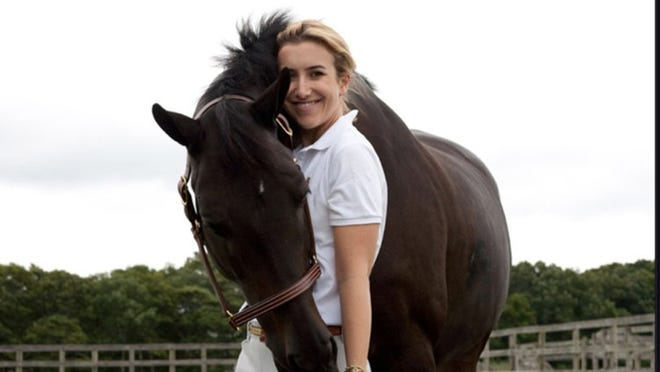 Stephanie Riggio Bulger with her show horse Breitling. Bulger recently took the reins as president of the Equestrian Aid Foundation after ten years of involvement. Photo by Val Shaff