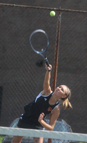 Taunton High first singles player Mollie McCaffrey serves during Thursday's Division I South Sectional tournament match against Brookline at Taunton High School.