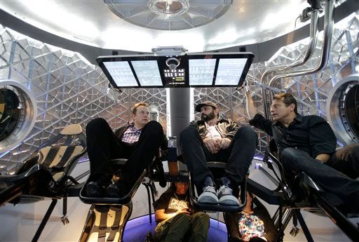 Elon Musk unveils spacecraft to ferry astronauts