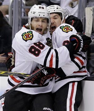 Chicago Blackhawks right wing Patrick Kane, left, celebrates his tie-breaking goal with center Andrew Shaw against the Los Angeles Kings during the third period of Game 6 of the Western Conference finals of the NHL hockey Stanley Cup playoffs in Los Angeles, Friday, May 30, 2014. The Blackhawks won 4-3. (AP Photo/Chris Carlson)