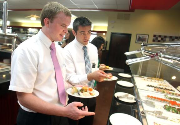 From left, Brandon Ray and Eric Stone look at sushi available at Ichiban in Shelby.
