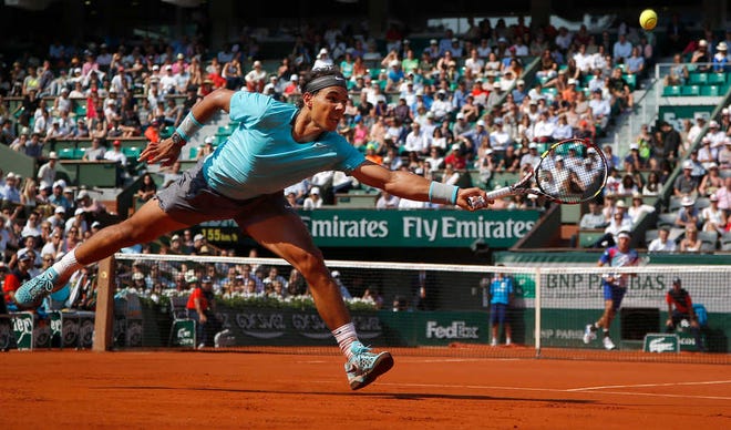 Spain's Rafael Nadal returns the ball during the third round match of the French Open tennis tournament against Argentina's Leonardo Mayer at the Roland Garros stadium, in Paris, France, Saturday, May 31, 2014. (AP Photo/Michel Euler)