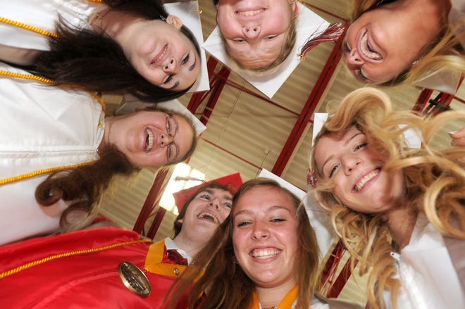 Silver Lake graduates, from left, Kendra Carley, Lily Shepherd, Meghan Flaherty, Kristin Ostiguy, Alyssa Goodwin, Matthew Asnes and Mackenzie Bowden pose for a picture at the Silver Lake Regional High School's 58th annual commencement on Saturday, May 31, 2014.