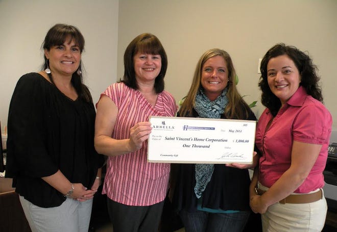 Harrington Insurance Agency presents a community gift to Saint Vincent's for Life Skills youth. Left to right: Harrington Insurance Agency Representatives Luisa Nunes and Diane Andrade; Saint Vincent's Life Skills Coordinator Rachele Foley; and Harrington Insurance Agency Representative Anna Brito.