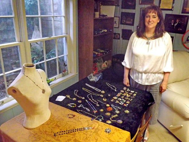 Topekan Sara Wood creates military-themed jewelry under the label Army Charming, a small business established about five years ago. She incorporates military medals and awards into her designs.